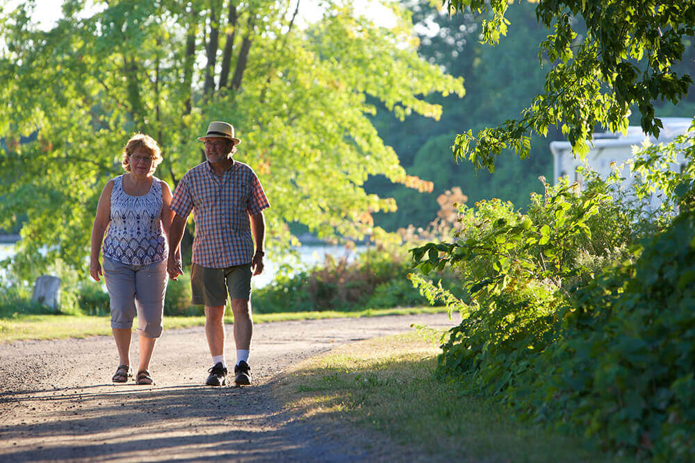 Man and woman walking through the campgrounds