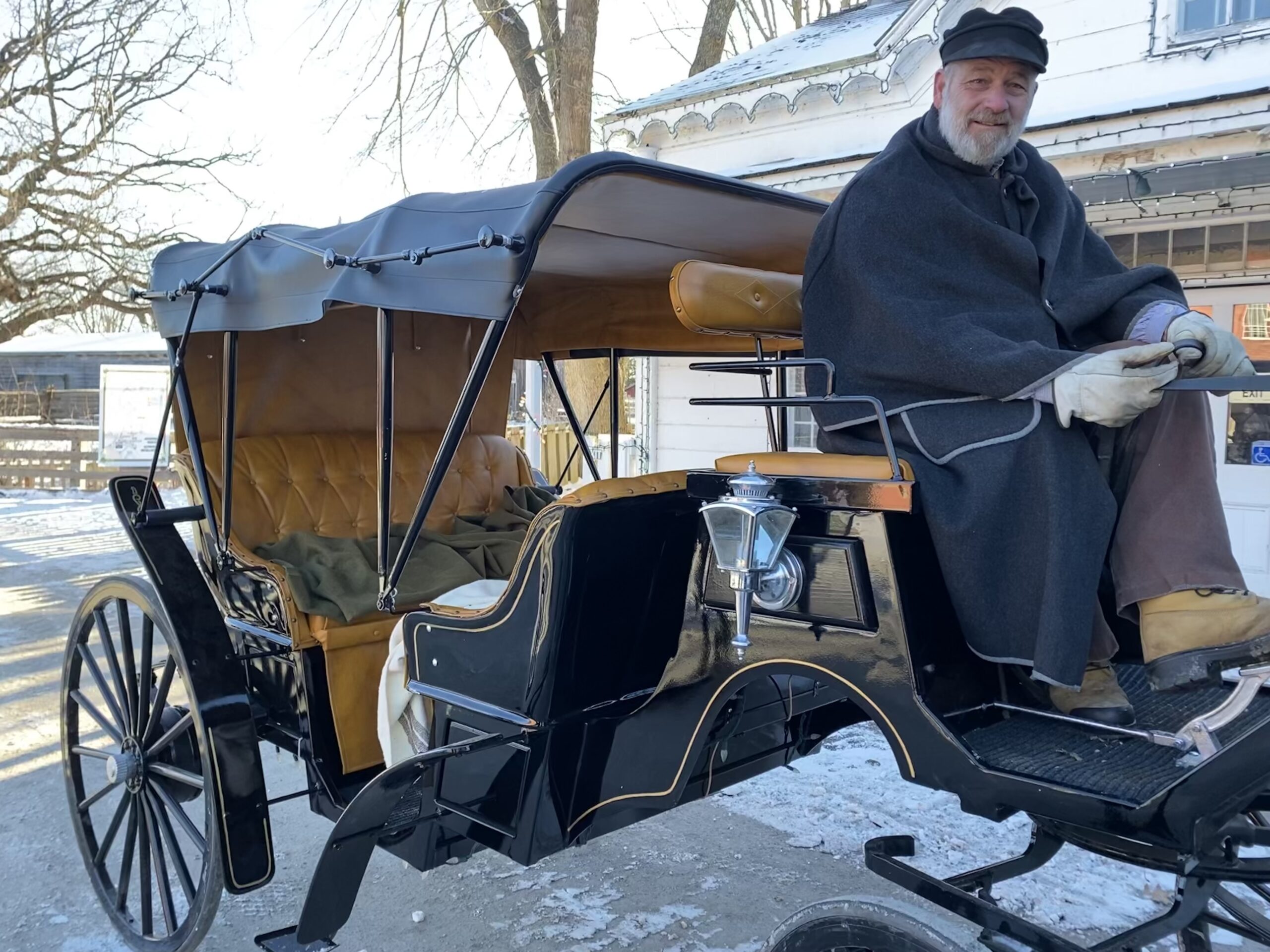 Pommier horse carriage ride on display at Upper Canada Village with interpreter.