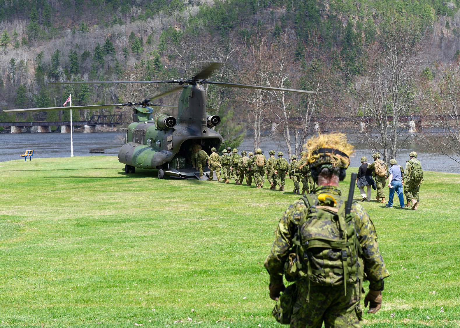 Canadian Armed Forces loading into helicopter.