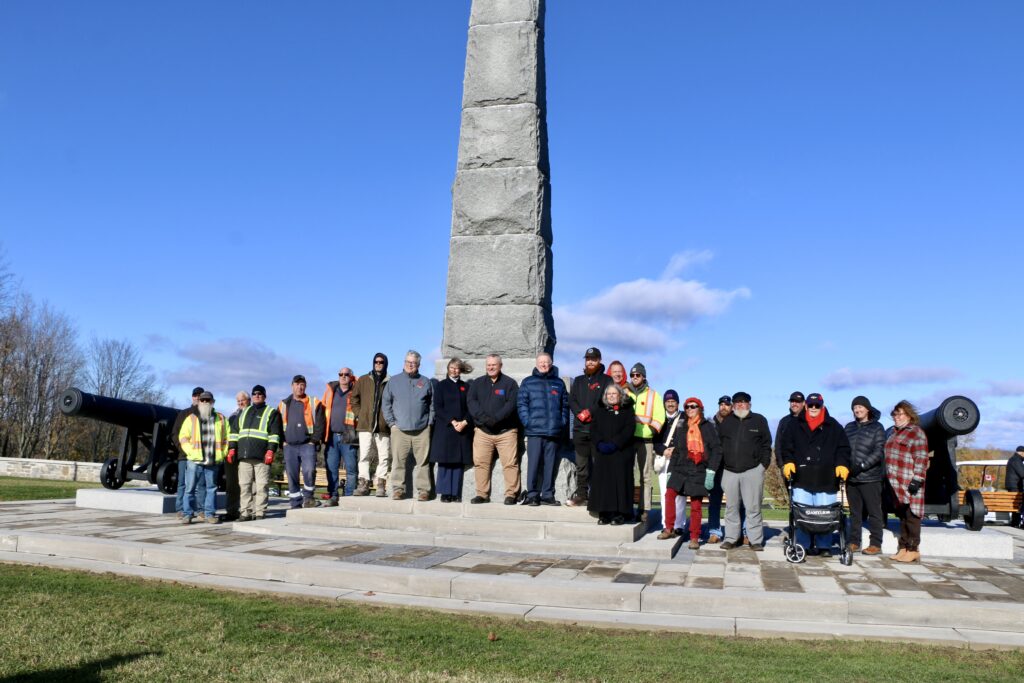 Group of people standing in front of Crylser Memorial Monument